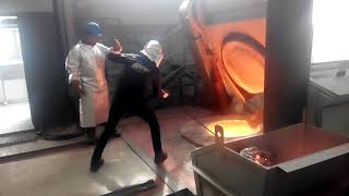 Removing slag from a molten metal furnace of 1400 C near view [upl. by Enitsirc313]