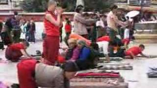 Pilgrims prostrating at Jokhang temple Lhasa Tibet [upl. by Ysdnil23]