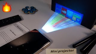 Elephas A1 REVIEW A PhoneSized DLP WiFi Projector [upl. by Lacombe]