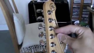 How To String A Guitar Part 1 [upl. by Namajneb789]