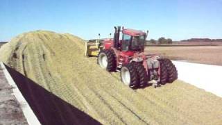 stx385 with degelman blade packing corn silage at bloemen dairy 2009 v2 [upl. by Akinnor356]