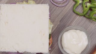 A girl putting lettuce leaf and bread slice on her vegetable s  Indian Stock Footage  Knot9 [upl. by Nwahs]