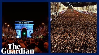 More than 1m people gather in Paris to watch New Years Eve firework display [upl. by Lynnett]