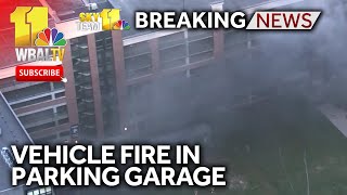 Crews extinguish vehicle fire in parking garage [upl. by Gail]