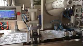 Automatic thermoforming plastic lid machine for paper cup application under production [upl. by Agnella]