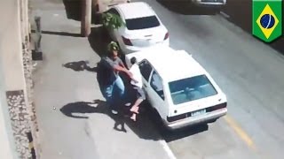 Brazilian man kicks wouldbe car thief to the ground with one blow [upl. by Jaunita]