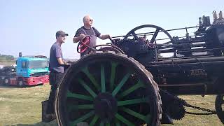 A Tractor pulling a Traction engine at the Haddenham steam rally [upl. by Reinar442]