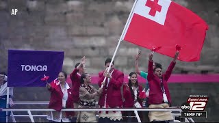 San Antonio resident Aki Epenisa carries Tonga’s flag at Summer Olympics’ opening ceremony [upl. by Rdnaskela]