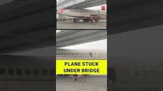 Unusual occurrence Aircraft gets stuck under bridge in Bihars Motihari [upl. by Ahtibbat]