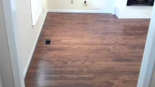 Laminate flooring flowing between rooms without a Tmolding [upl. by Maure]