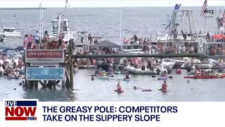 Greasy Pole Competition the slippery slope at St Peters Fiesta in Gloucester Massachusetts [upl. by Hanover]