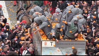 FOOD FIGHT Thousands gather in Ivrea Italy to pummel each other with 11 million pounds of oranges [upl. by Weigle297]