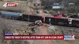 Conductor taken to hospital after train hits semi in Logan County [upl. by Tallu]