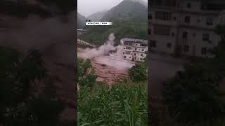 Building collapses into floodwaters in China  AccuWeather [upl. by Michaeline]