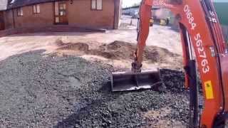 Kubota U253 Mini Digger Grading Stone [upl. by Nnahgaem]