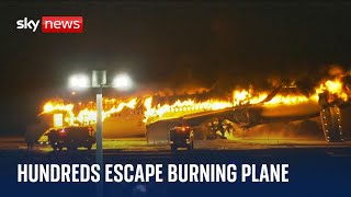 Japan plane fire Passengers evacuated after planes collide at Tokyo airport [upl. by Idnat]