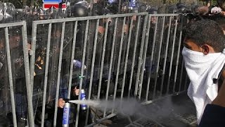 Hungarian Riot Police Face Off With Migrants [upl. by Ahsiekin]