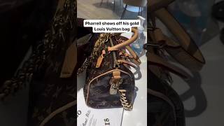 Pharrell shows off his crocodile Louise Vuitton Millionaire Speedy Bag with Gold Hardware [upl. by Eitten]