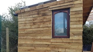 Cladding the pallet sheds DIY pallet shed man cave shed [upl. by Ano595]