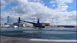 Robinson R44 despegando del helipuerto del puerto de barcelona [upl. by Naimad]