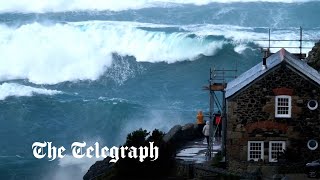 Storm Noa huge waves crash over Cornish coast as 90mph winds lash UK [upl. by Ataga]