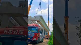 The construction site uses a large crane to lift heavy materials [upl. by Verlie]