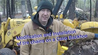 Installing tire chains on a 1968 Case 580ck backhoe [upl. by Merv]