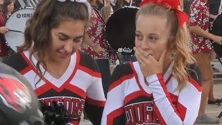 Football players kind gesture to cheerleader goes viral [upl. by Ahsyekat]