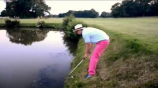 Drunk golfer falls in the water trying to hit golf ball [upl. by Ylrebnik]