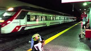 Renfe Train Torremolinos Station Spain Woman walks in front of train [upl. by Eetse301]