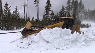 Plowing snow from roads in the spring in Yellowstone National Park [upl. by Esinehs]