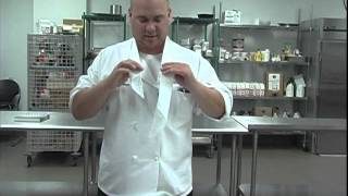 The Chefs Academy How to tie a neckerchief [upl. by Leinto]