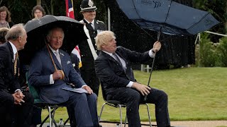 Boris Johnson struggles with umbrella at police memorial unveiling [upl. by Paucker]