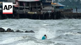 Floods in Philippines kill at least 9 and trap others on roofs [upl. by Anyehs]