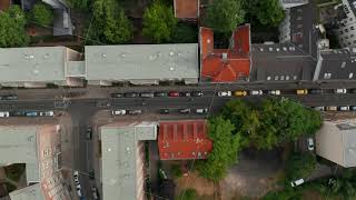 Aerial birds eye overhead top down view of bike highway leading through urban neighbourhood [upl. by Phillie]