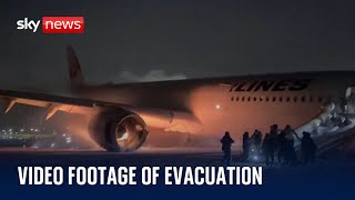 New footage of passengers evacuating burning plane in Japan [upl. by Airotkiv]