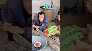 The process of cutting watermelon with steel knife [upl. by Ahrendt]