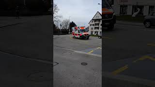 Two emergency ambulance cars with sirens in city of Zug Switzerland [upl. by Illehs]