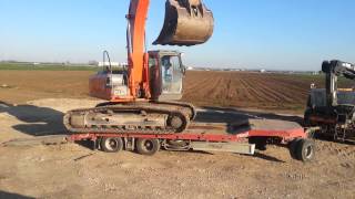 Hitachi 210 LC Climbing on the trailer [upl. by Artima372]