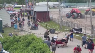 Monster truck hits utility wires during jump pulling debris onto crowd nearby [upl. by Gnoud]