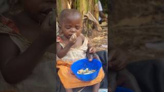 African 1year old baby is feeding by herself shortfeed africa [upl. by Carny]