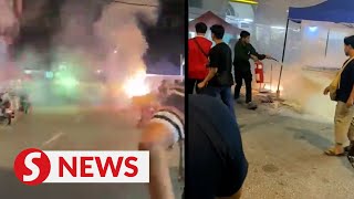 Impromptu fireworks display triggered by fire at unlicensed night market stall [upl. by Devlen]