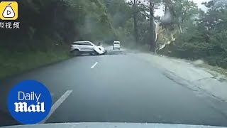 Shocking moment car is smashed by a massive BOULDER [upl. by Nedrob455]