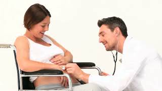 Pregnant Woman in Wheelchair receiving Doctors Help on White Background Video  WaveBreak Media [upl. by Aiclid632]