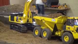 Komatsu PC 490 LC loads Bell B40D with sand [upl. by Veradis953]