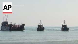 British soldiers piper mark 80th anniversary of DDay with reenactment on Normandy beach [upl. by Hbaruas]