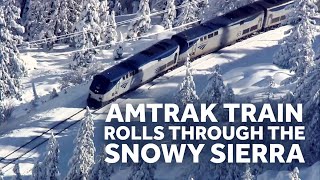 Amtrak Train Crawls through the Snowy Sierra Mountains in California [upl. by Atirihs]