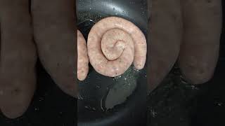 Cumberland swirl sausage cooking [upl. by Atinar]