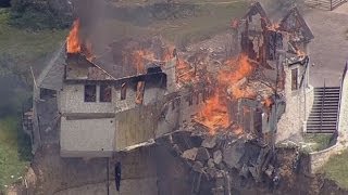 Burning down the house Texas family burn down luxury home that hangs over 75ft cliff [upl. by Salvay927]