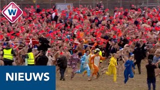 Nieuwjaarsduik 2019 Duizenden rennen naar de zee  OMROEP WEST [upl. by Siva]